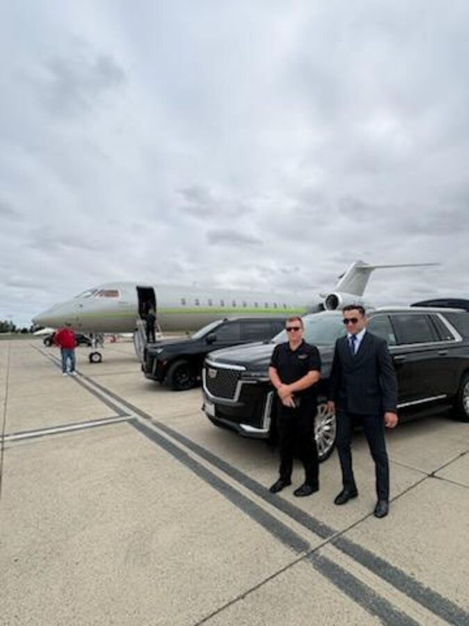 SFDRIVEN chauffeur greeting a client on the tarmac beside a private jet